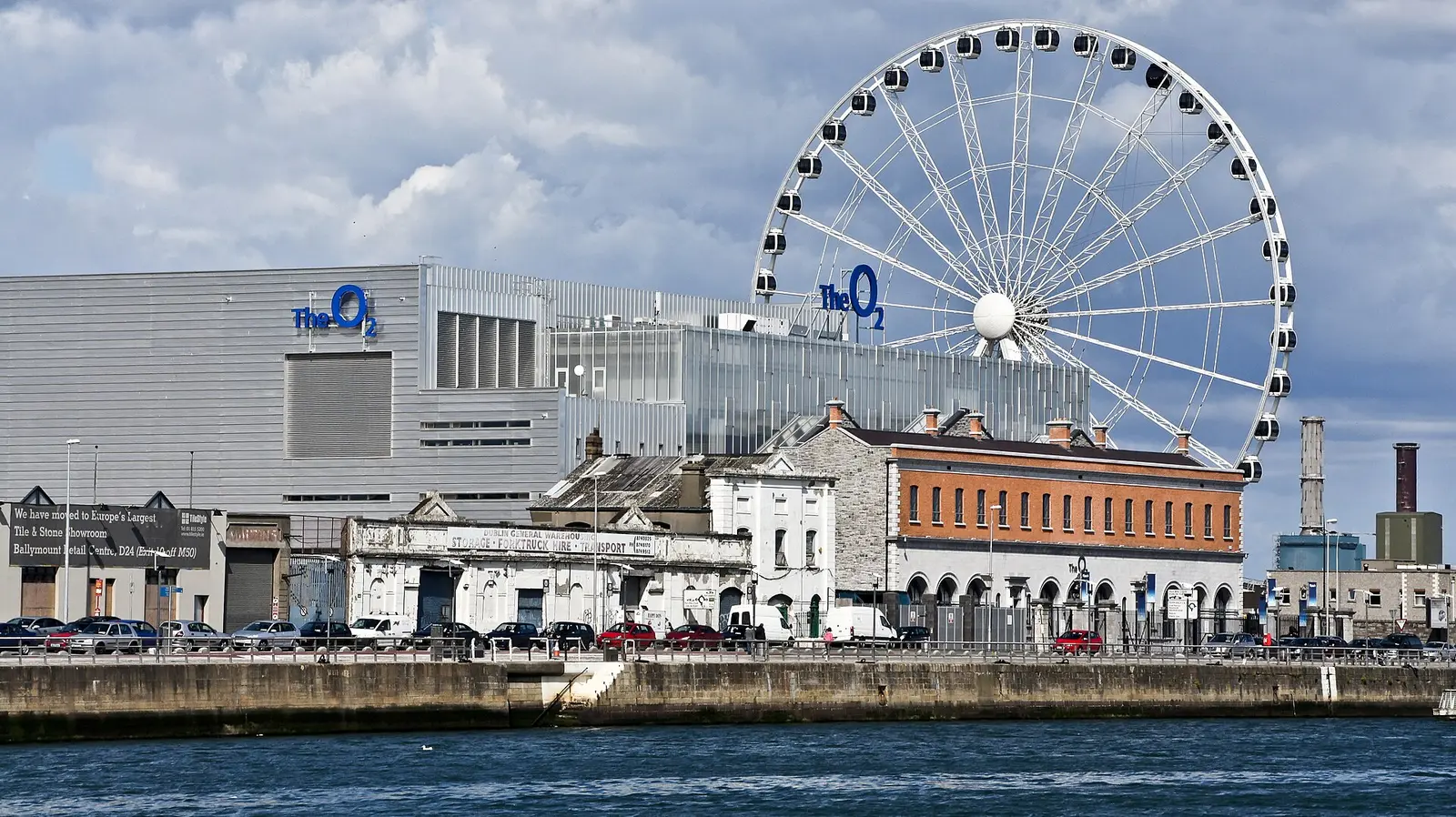 3Arena in Dublin docklands with the ferris wheel behind the old brick building
