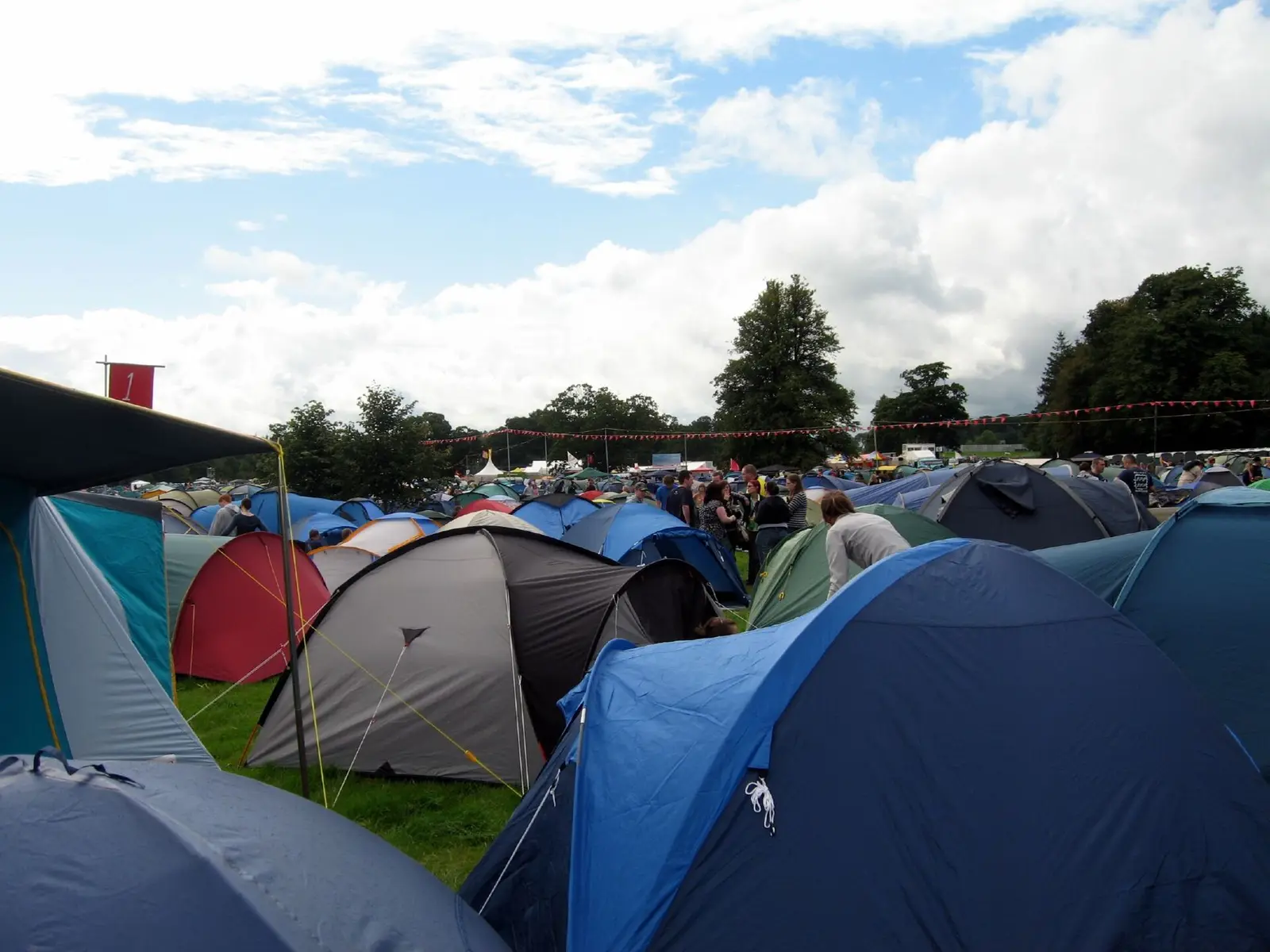 Tents pitched on the grass at the Electric Picnic campsite under a cloudy sky in 2006